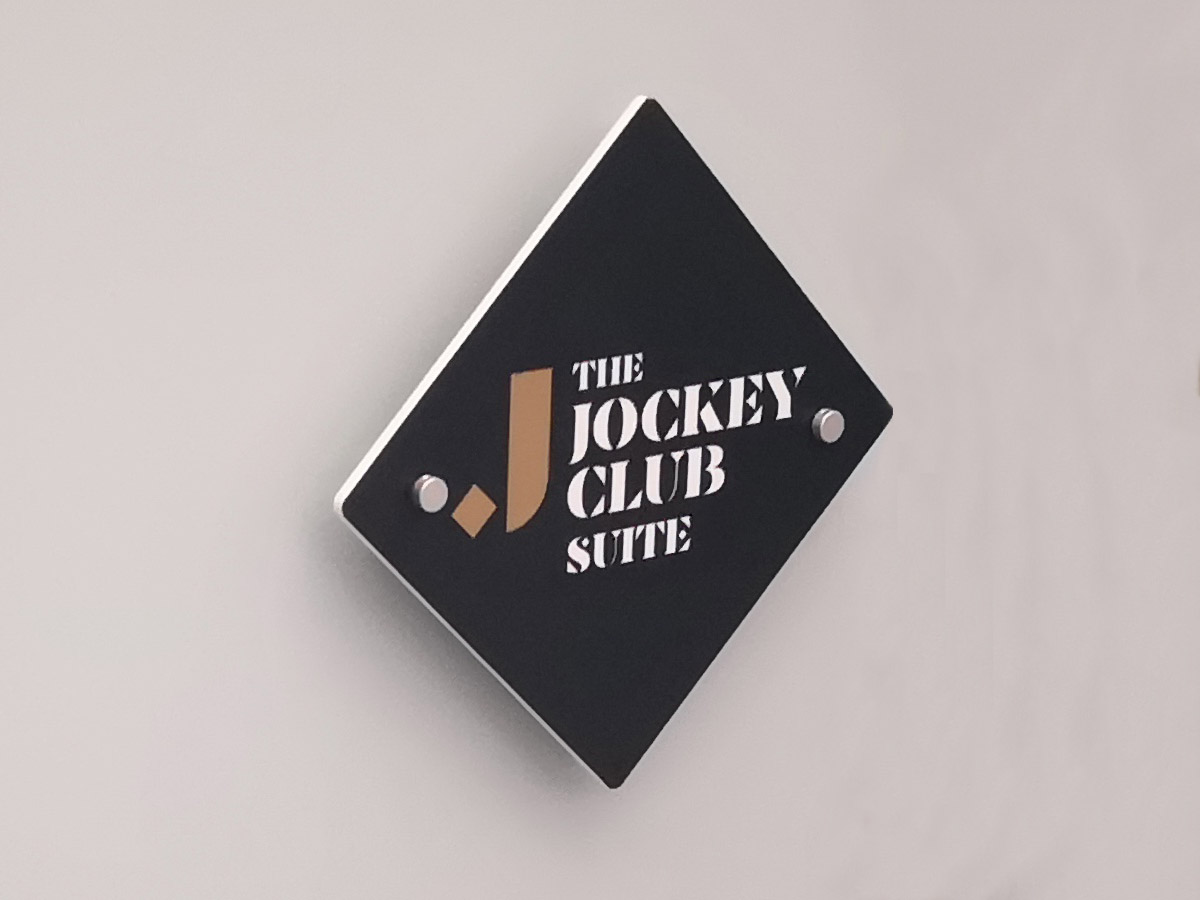 the jockey club logo raised sign